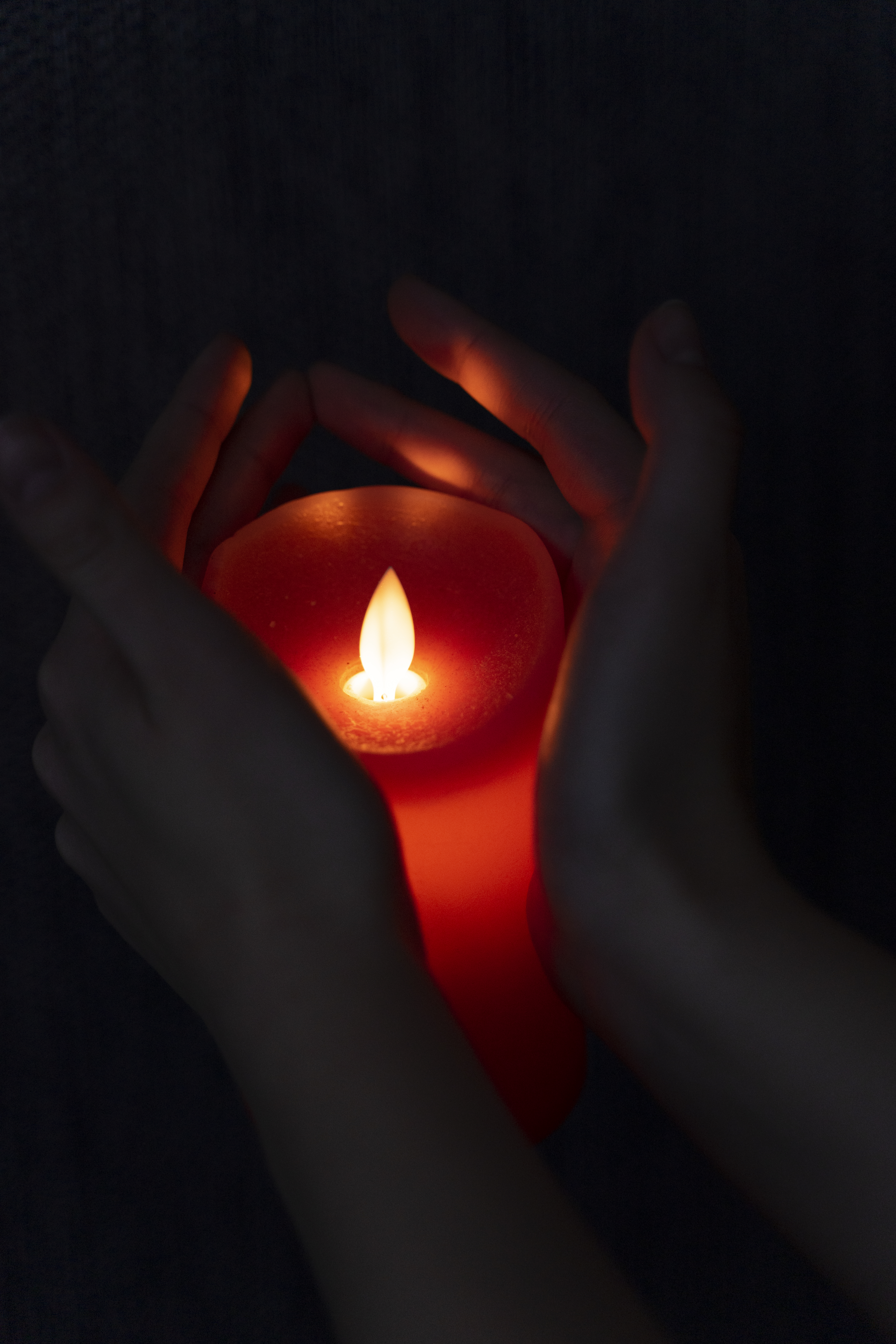 view-hands-holding-candle-light