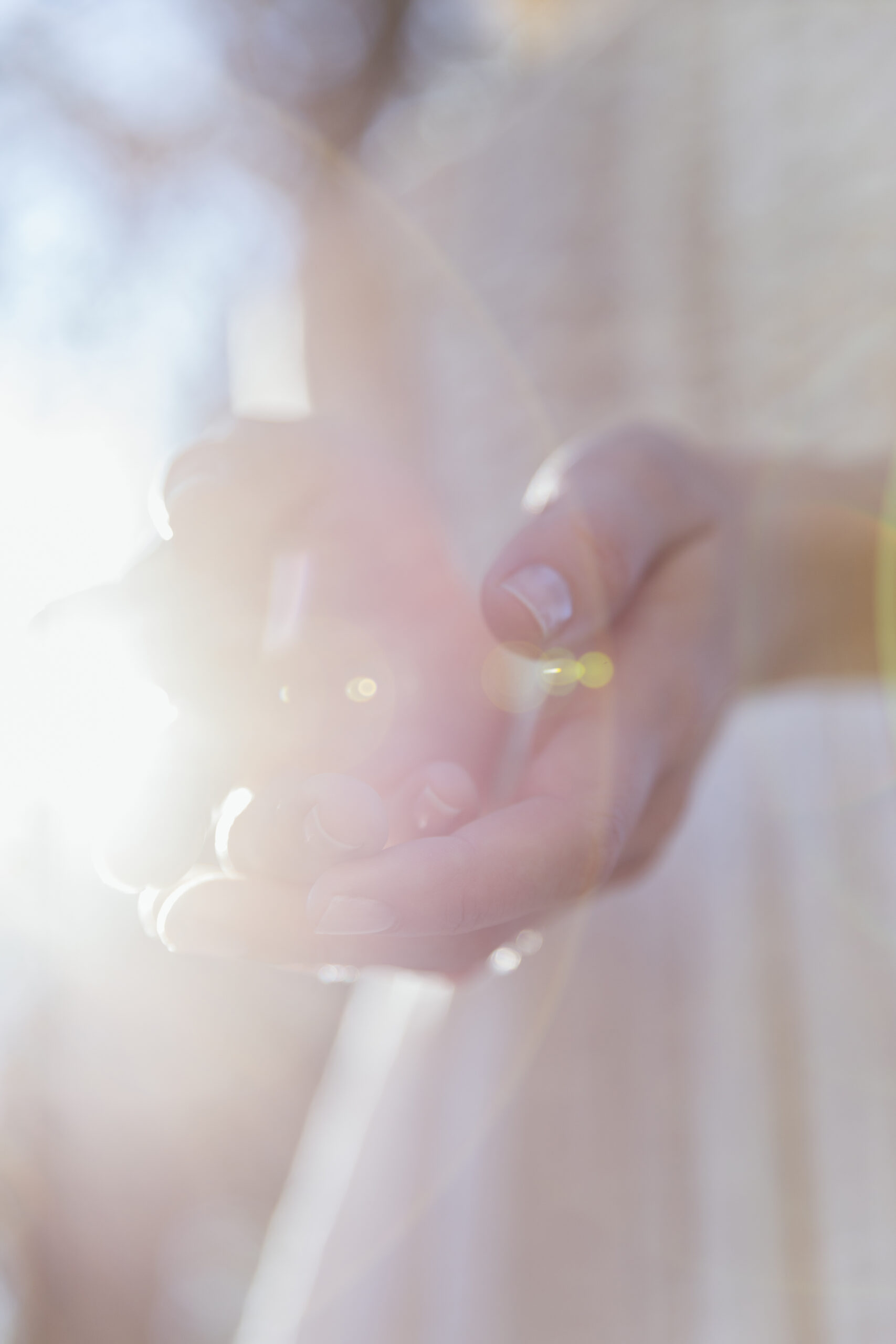 woman-holding-her-hands-sunlight